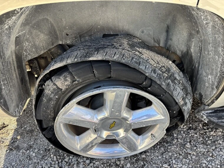 Home tire burst on roadside